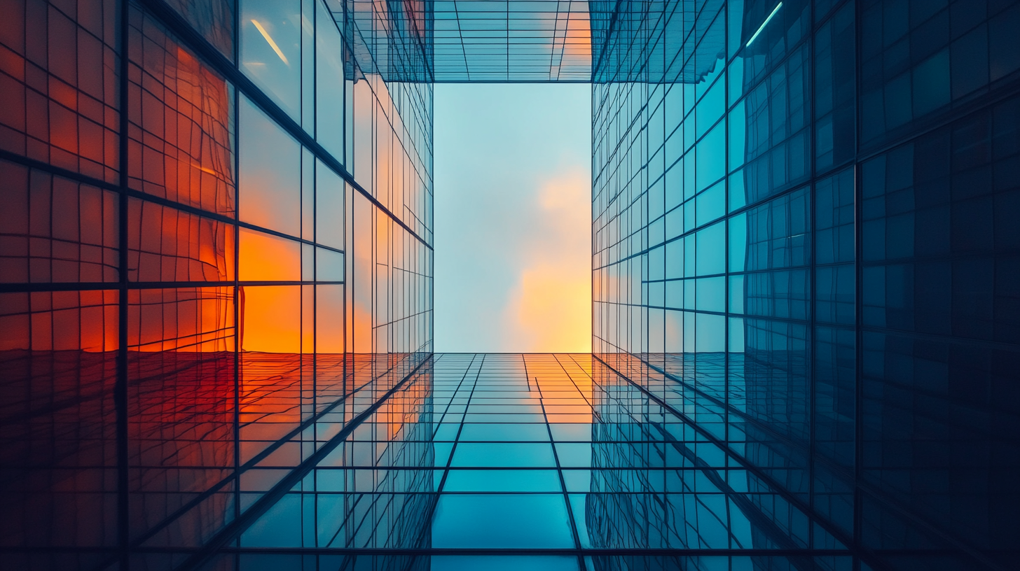 Image looking up to the sky surrounded by skyscapers